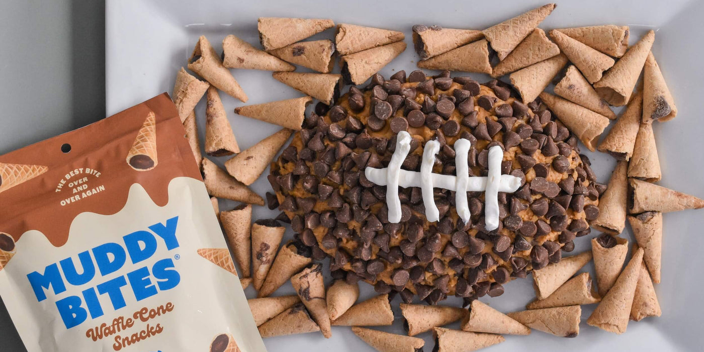 Peanut butter football dip made with Muddy Bites for a game day treat