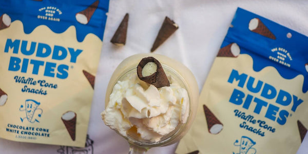 Vanilla milkshake garnished with Muddy Bites to celebrate National Vanilla Milkshake Day.