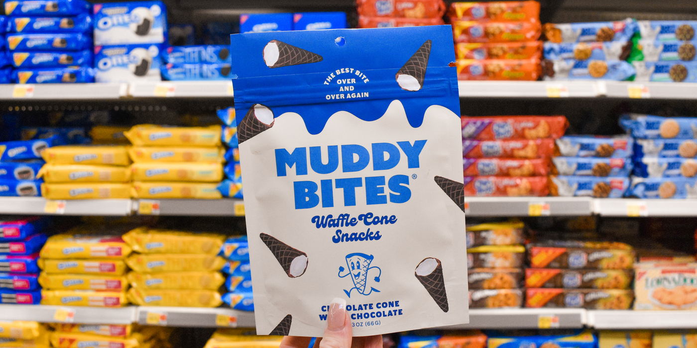 Package of Muddy Bites displayed on a grocery store shelf, with other snacks in the background.